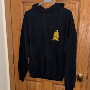 Black Men's Hoodie with Yellow Flame Skull Graphic